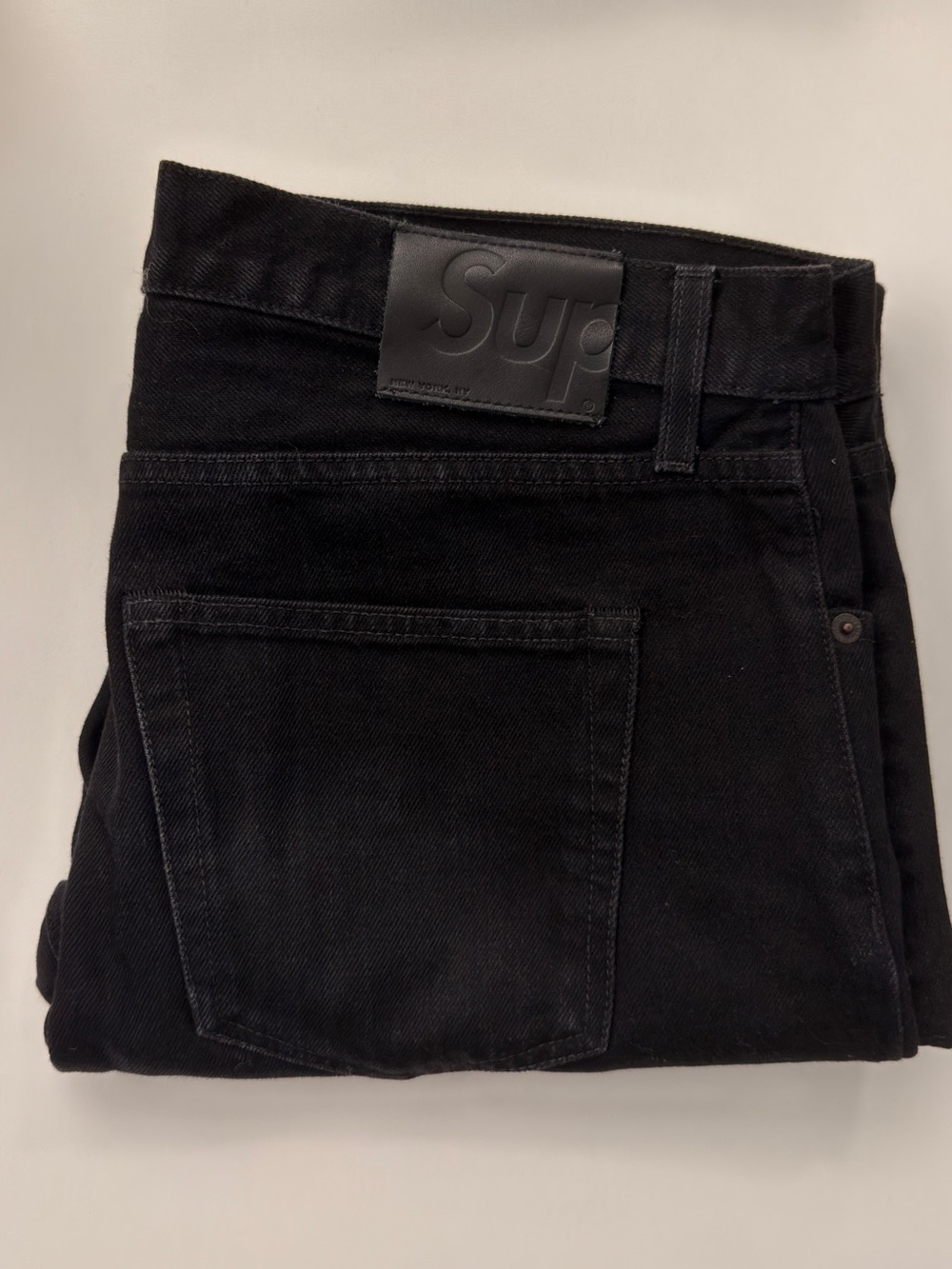 Supreme Black Slim Men's Jeans with Embossed Logo Patch